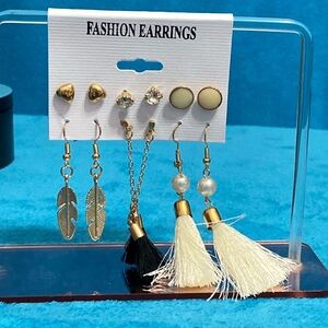 Brand new Eaering gold in color with white and black.